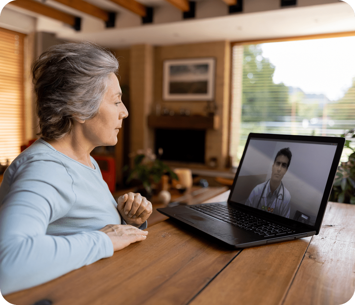 Elderly woman in video call with doctor.