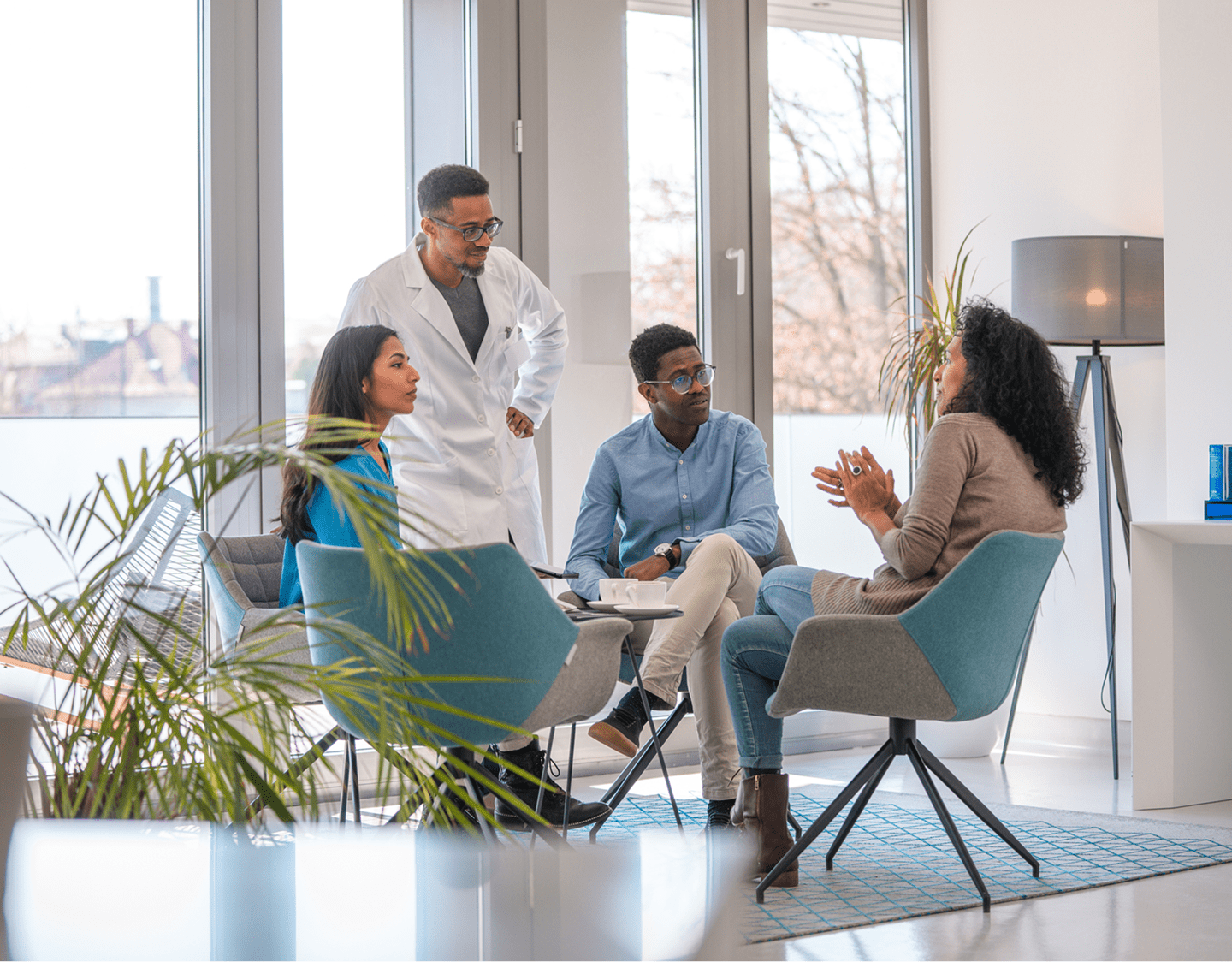 Group meeting in modern office setting.